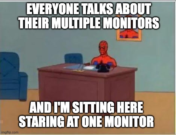 meme spiderman sitting at desk